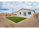 Backyard featuring artificial grass, gravel, pavers, with block wall at 5147 Stonecrop St, North Las Vegas, NV 89031