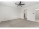 Bright bedroom with carpet, ceiling fan, and neutral walls, providing a blank canvas at 5147 Stonecrop St, North Las Vegas, NV 89031