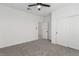 A bright bedroom with a ceiling fan and closet at 5147 Stonecrop St, North Las Vegas, NV 89031