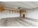 Spacious two-car garage with painted walls and wood shelving at 5147 Stonecrop St, North Las Vegas, NV 89031