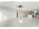 Open living space with modern tile flooring that connects to the kitchen at 5147 Stonecrop St, North Las Vegas, NV 89031