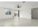 Open living space with modern tile flooring and access to outdoor space at 5147 Stonecrop St, North Las Vegas, NV 89031