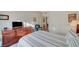 Spacious bedroom with dresser, TV, and access to other rooms at 5751 E Hacienda Ave # 172, Las Vegas, NV 89122