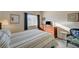 Comfortable bedroom with natural light, dresser, and decorative chair at 5751 E Hacienda Ave # 172, Las Vegas, NV 89122