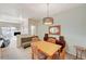 Dining room table set for four with adjacent sitting area at 5751 E Hacienda Ave # 172, Las Vegas, NV 89122