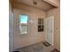 Close up of unit entryway with security doors and two windows at 5751 E Hacienda Ave # 172, Las Vegas, NV 89122