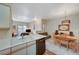 Open concept kitchen with breakfast bar flowing into the living and dining areas at 5751 E Hacienda Ave # 172, Las Vegas, NV 89122