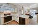 Open-concept kitchen flows to a living room with a patio at 5751 E Hacienda Ave # 172, Las Vegas, NV 89122