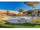 Outdoor community pool with seating and well-maintained landscaping at 5751 E Hacienda Ave # 172, Las Vegas, NV 89122