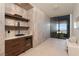 Modern bar area with a wine fridge, wood accents, and a view of the yard at 6 Rockmount Ct, Henderson, NV 89012