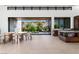 Open dining area flows to backyard with custom kitchen and designer decor at 6 Rockmount Ct, Henderson, NV 89012