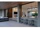 Stylish open-concept living space, with bar, sleek seating, and wood accents at 6 Rockmount Ct, Henderson, NV 89012