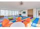 Bright playroom with colorful seating, built-in shelving, and large windows perfect for creative activities at 6 Rockmount Ct, Henderson, NV 89012
