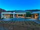 Backyard view of modern home with a pool overlooking mountains during dusk sky at 6 Rockmount Ct, Henderson, NV 89012