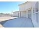 View of the backyard with a concrete patio and a neutral color palette at 6120 Farm Rd, Las Vegas, NV 89131