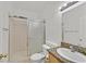 Cozy bathroom featuring a toilet, sink with granite countertop, and a glass-enclosed shower at 6120 Farm Rd, Las Vegas, NV 89131