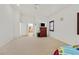 Large bedroom with carpet flooring and a doorway leading to an en-suite bathroom at 6120 Farm Rd, Las Vegas, NV 89131