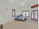 Bright bedroom with carpeted floors and a ceiling fan for comfortable climate control at 6120 Farm Rd, Las Vegas, NV 89131