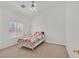 Bedroom with a light color scheme, blinds, and a single bed and nightstand at 6120 Farm Rd, Las Vegas, NV 89131