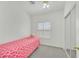 Simple bedroom with a single bed, neutral tones, and a sliding-door closet at 6120 Farm Rd, Las Vegas, NV 89131