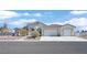 Well-maintained single-story home with a three-car garage and beautiful desert landscaping at 6120 Farm Rd, Las Vegas, NV 89131