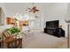 Spacious living room with ceiling fans and open access to the kitchen area at 6120 Farm Rd, Las Vegas, NV 89131