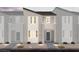 A modern home featuring a two-story design with a private balcony and neutral color scheme at 6668 Nimbus Ave # Lot 22, Las Vegas, NV 89130