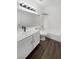Clean, all-white bathroom featuring new fixtures, a vanity with storage, and a tub and shower combo at 6701 Squaw Mountain Dr # 201, Las Vegas, NV 89130