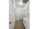 White hallway features cabinets for storage and multiple doors at 6701 Squaw Mountain Dr # 201, Las Vegas, NV 89130