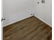 An empty laundry room with wood look floors ready to be set up at 6701 Squaw Mountain Dr # 201, Las Vegas, NV 89130