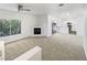 Open concept living room with fireplace, large windows and dining area at 6701 Squaw Mountain Dr # 201, Las Vegas, NV 89130
