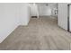 Expansive carpeted living room with a large window at 6701 Squaw Mountain Dr # 201, Las Vegas, NV 89130