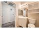 Well-lit bathroom vanity with a mirror, cabinet, and nearby toilet at 6868 Sky Pointe Dr # 1087, Las Vegas, NV 89131