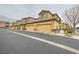 Exterior view of the home showcasing attached garages and well-maintained landscaping at 6868 Sky Pointe Dr # 1087, Las Vegas, NV 89131