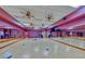 Spacious gym with mirrored walls, wood floors, and exercise equipment for a full workout at 7640 Fieldfare Dr, North Las Vegas, NV 89084