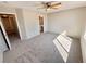 Spacious bedroom with a ceiling fan and plush carpeting at 7896 Muldrow St, Las Vegas, NV 89139