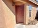 Close-up of the front door with the home's exterior siding at 7896 Muldrow St, Las Vegas, NV 89139