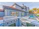 Backyard featuring built in BBQ, pool, grass and the rear exterior of the home at 8625 Scarsdale Dr, Las Vegas, NV 89117