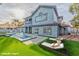 Pool and jacuzzi with lounge chairs on an expansive manicured lawn at 8625 Scarsdale Dr, Las Vegas, NV 89117