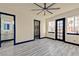 Bedroom with ensuite bathroom, walk-in closet, and an abundance of natural light at 8625 Scarsdale Dr, Las Vegas, NV 89117