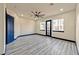 Spacious bedroom with dark-trimmed doors and windows, a modern fan, and tile flooring at 8625 Scarsdale Dr, Las Vegas, NV 89117