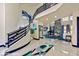 Spacious entryway with spiral staircase, marble floors, and views into the adjacent living areas at 8625 Scarsdale Dr, Las Vegas, NV 89117