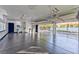 Large garage with ample space, featuring a water treatment system and access to the backyard at 8625 Scarsdale Dr, Las Vegas, NV 89117