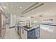 Large kitchen featuring two islands, marble floors, stainless appliances, and bar seating at 8625 Scarsdale Dr, Las Vegas, NV 89117