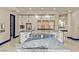 Gourmet kitchen featuring stainless steel appliances, white cabinets, and a marble island at 8625 Scarsdale Dr, Las Vegas, NV 89117