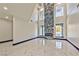 Bright living room showcasing marble floors and modern fireplace at 8625 Scarsdale Dr, Las Vegas, NV 89117