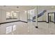 Expansive living area featuring marble floors and large windows at 8625 Scarsdale Dr, Las Vegas, NV 89117