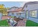 Inviting patio area featuring stylish outdoor seating and a cozy fire pit at 8625 Scarsdale Dr, Las Vegas, NV 89117