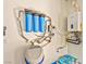Water filtration system and tankless water heater installed in a clean utility area at 8625 Scarsdale Dr, Las Vegas, NV 89117