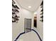 Modern wine cellar with sleek racks and a glass door at 8625 Scarsdale Dr, Las Vegas, NV 89117